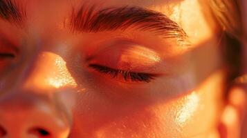 Through closed eyes the persons skin glows with a healthy flushed tone due to the infrared heat. photo