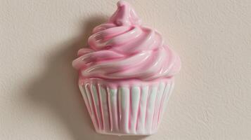 A ceramic coat hook in the shape of a cupcake perfect for adding a touch of whimsy to a childs room or playroom. photo