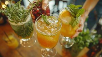 The host greets guests with a warm smile offering a selection of nonalcoholic cocktails made with fresh juices and herbs photo