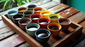 A wooden tray filled with different colored coffee cups each holding a different brew from a tropical island photo