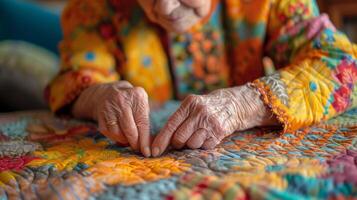 With steady hands and a keen eye for detail an elderly quilter stitches together a beautiful story on fabric a reflection of her lifes journey photo