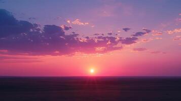 A stunning sunset on the horizon painting the sky with pinks oranges and purples photo