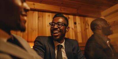 A group of people in suits exchanging stories and laughs while enjoying a sauna session. photo