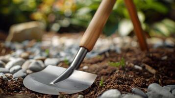 Closeup of a sy yet stylish garden spade with a comfortable ergonomic handle making digging and planting a breeze photo