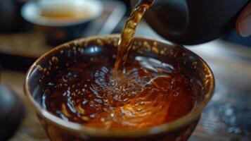 The richness of the teas color is mesmerizing swirling and dancing in the cup as he takes in the aroma photo