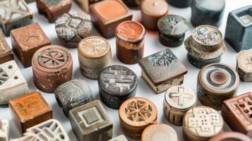 An assortment of different shaped and sized signature stamps catering to various styles of pottery. photo