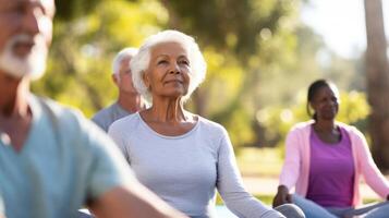 Balanced on their mats a group of seniors practice yoga poses in a peaceful outdoor setting filled with fresh air and sunshine photo