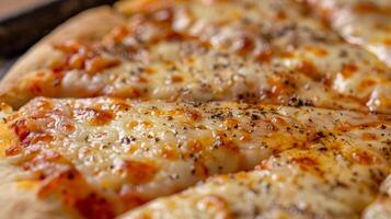 A closeup of the finished pizza golden brown crust with bubbling cheese and perfectly p toppings photo