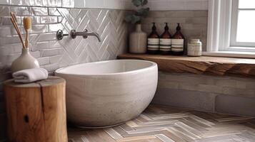 A closeup of a chevron tile pattern in shades of grey adding a subtle yet stylish touch to this bathroom floor photo