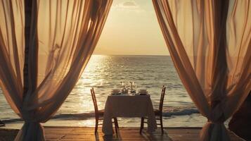 The ocean breeze gently rustling through white curtains surrounding the intimate dinner table photo