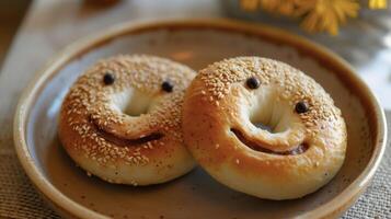 A plate holds two delightful bagels their faces formed by the toasting process their expressions bright and welcoming to anyone lucky enough to take a bite photo