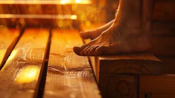 Feet dangling off the edge of a saunas bench showcasing the heats ability to alleviate joint pain and stiffness. photo