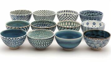 A set of ceramic bowls with unique nerikomi patterns in shades of blue green and white. photo