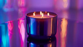 A decadent triplewicked candle in a sleek black jar releasing a rich vanilla and amber fragrance photo