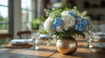 A creative DIY project with mason jars painted in metallic silver and gold finishes being used as unique vases to add a touch of glamour to a simple dining room table photo