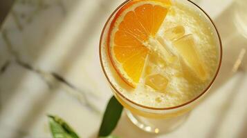 A splash of citrus mocktail expertly paired with a sharp cheddar cheese photo