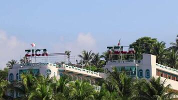 Puerto Escondido Oaxaca Mexico 2022 Hotels resorts buildings in paradise among palm trees Puerto Escondido. video