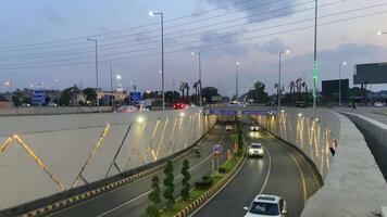 View of traffic passing from under pass in DHA Lahore, Pakistan on April 27, 2024 video