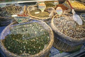 Baskets of spices in the market stall photo