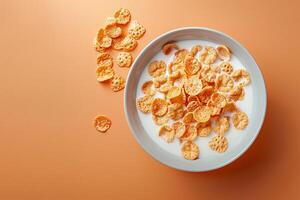 gastos generales ver de un cuenco de Leche con cereal, conjunto en contra un amable naranja degradado fondo, Mañana tema foto