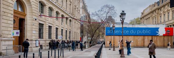 Quiet Parisian street scene with diverse pedestrians and election billboards, symbolizing democracy, shot on April 14th, 2024, ahead of Frances national elections photo