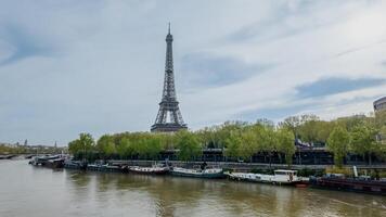 Springtime in Paris with a serene Seine River and the iconic Eiffel Tower, captured on April 14th, 2024, perfect for travel and European landmarks themes photo