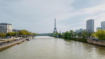 Springtime in Paris, France with a serene view of the Seine River and the Eiffel Tower, captured on April 14th, 2024, ideal for travel and tourism themes photo