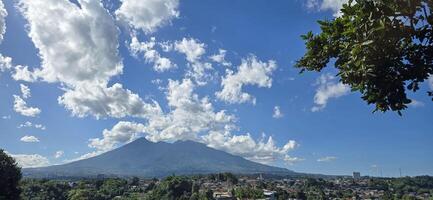 Beautiful landscape morning view of Mount Salak or Gunung Salak taken from batu tulis area in central Bogor city Indonesia photo