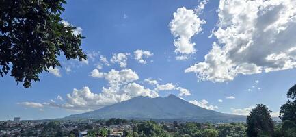 Beautiful landscape morning view of Mount Salak or Gunung Salak taken from batu tulis area in central Bogor city Indonesia photo