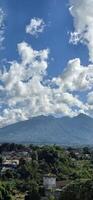 Beautiful landscape morning view of Mount Salak or Gunung Salak taken from batu tulis area in central Bogor city Indonesia photo