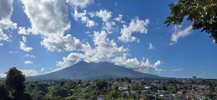 Beautiful landscape morning view of Mount Salak or Gunung Salak taken from batu tulis area in central Bogor city Indonesia photo