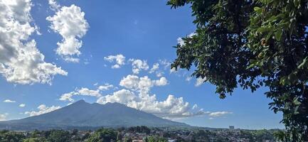 Beautiful landscape morning view of Mount Salak or Gunung Salak taken from batu tulis area in central Bogor city Indonesia photo