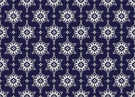 White geometric and symbol flowers design on dark blue background, ethnic fabric seamless pattern design for cloth, carpet, batik, wallpaper, wrapping etc. vector