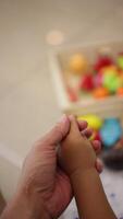 Slow motion, Close-up of a father's hand holding his son's hand. video