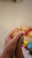 Father's hand holding child's hand slow motion video