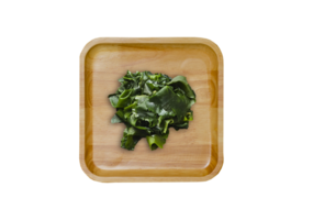 Wakame seaweed on a wooden plate on transparent background. Top view png