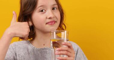 Pretty teen girl, child with a fresh glass of water video