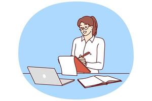 Successful businesswoman or freelancer girl working via Internet is at workplace with laptop vector