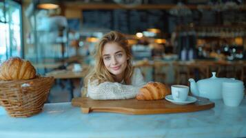 Young Woman Enjoying a Cozy Italian Breakfast with Croissants photo