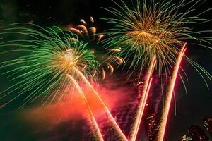 fireworks on the river in the dark sky photo