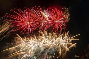 fireworks on the river in the dark sky photo