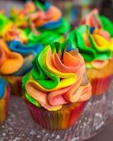 Colorful cupcakes with rainbow cream. photo