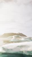 A large iceberg floating in the middle of a lake video