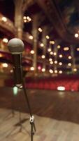 An empty stage with chairs and a microphone video