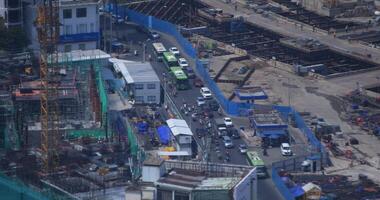 A traffic jam near the under construction in Ho Chi Minh high angle long shot video