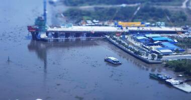 A high angle view of miniature cityscape at Saigon river in Ho Chi Minh tiltshift video