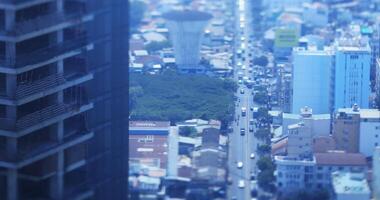 uma Alto ângulo Visão do miniatura paisagem urbana às a centro da cidade dentro ho chi minh dia inclinação video