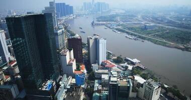 A high angle view of panoramic cityscape at Saigon river in Ho Chi Minh wide shot video