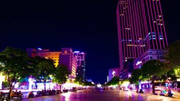 A night timelapse of neon town at Nguyen Hue street in Ho Chi Minh wide shot panning video