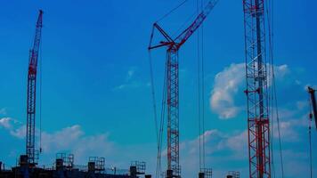 A timelapse of cranes at the under construction in Tokyo video